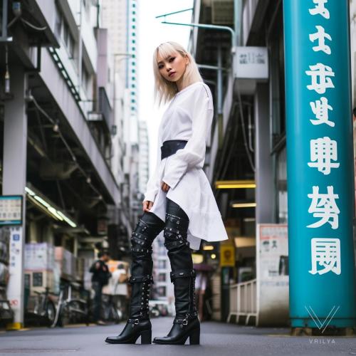 White blouse, black boots. 