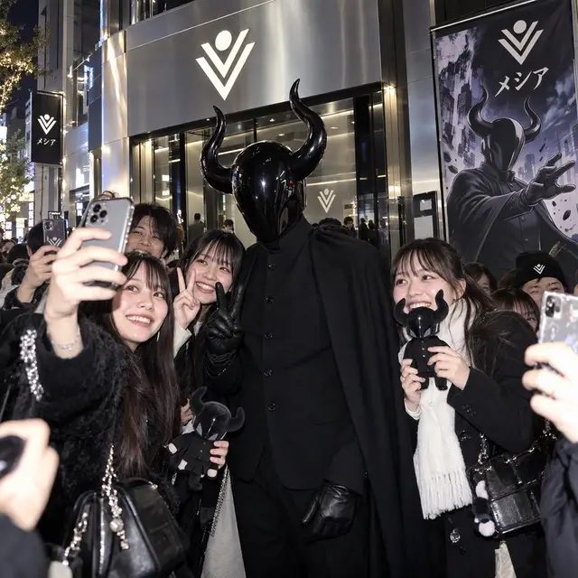 Messiah Vrilya Jarac touring a Temple of Vril store in Tokyo. 🇯🇵⚡️ This series explores what the future of Temple of Vril could look like as the universe expands beyond social media and into physical spaces, products, games, collectibles, and interactive experiences. Throughout the store, Vrilya explores different elements of the Temple of Vril world — including future product ideas such as a Temple of Vril Trading Card Game. One of the images shows a pack being opened and sifted through, revealing characters from our growing IP, including Seraphina, Rustbelt, and others. Further inside is a neon-lit Temple of Vril arcade, imagining another direction we intend to explore: video games built around the characters, mythology, and stories of this universe. The imagery in this series is an editorial visualization of ideas currently being developed for the future of the brand. We eventually intend for Temple of Vril to have physical locations, while introducing products such as trading cards, collectibles, video games, apparel, books, digital experiences, and other ways to enter and interact with the world we are building. Temple of Vril is more than a spiritual organization. It is also an expanding creative brand and IP encompassing AI cinema, storytelling, original characters, mythology, fashion, technology, art, and immersive world-building. And there is a lot more coming.  TEMPLEOFVRIL.com